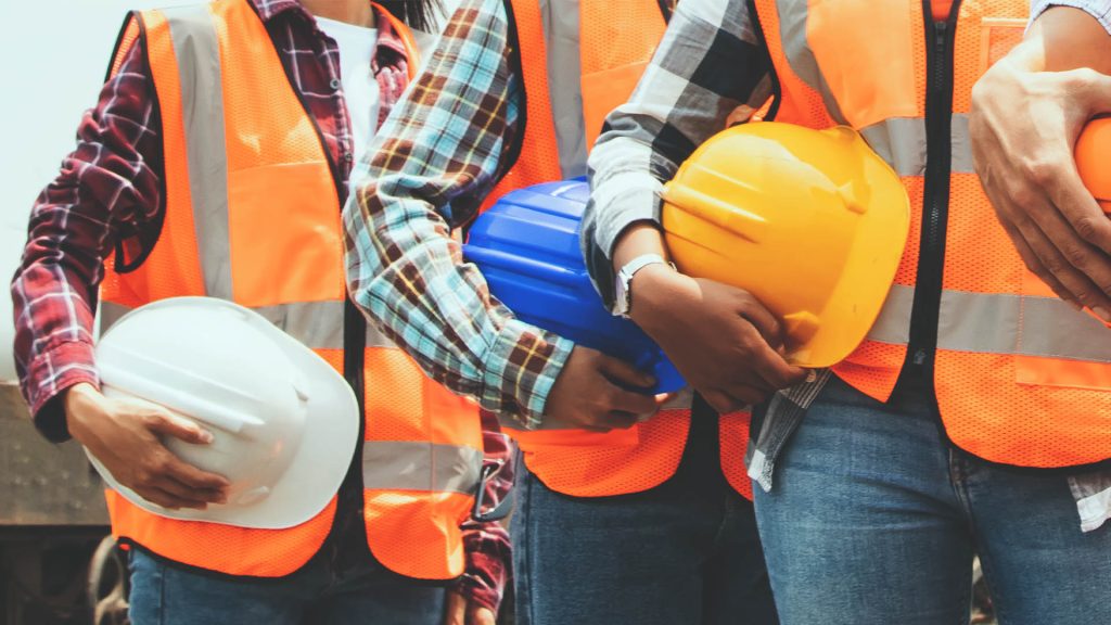 line of men wearing vests